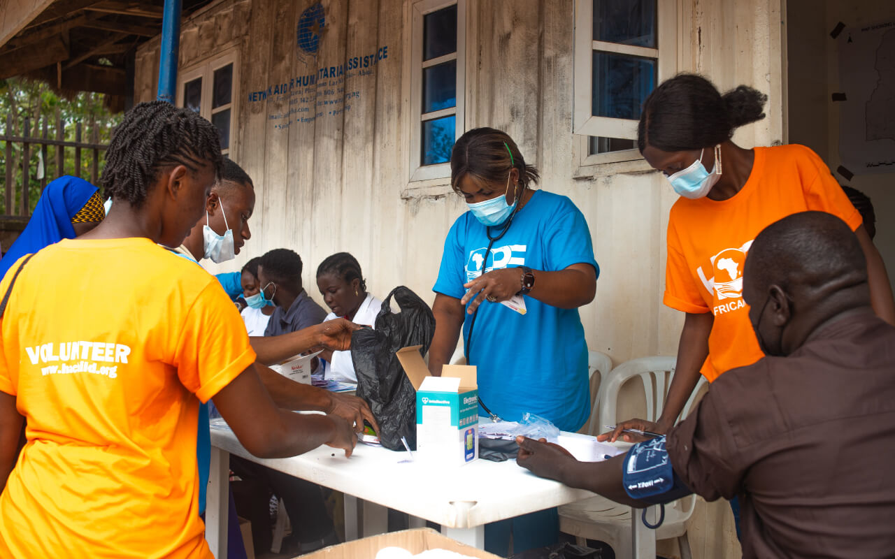 HOPE-Volunteer-checking-blood-pressure-during-a-medical-camp